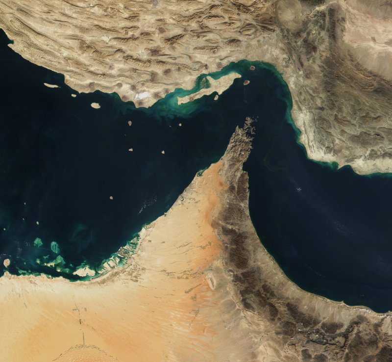 Satellite view of Strait of Hormuz showing narrow sea passage between Iran and Musandam peninsula